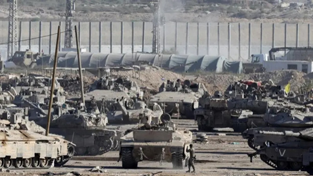 Photo: Israeli military convoy near a gathering point close to the Gaza border | Reuters
