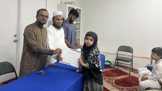 Honorable Chief Guest distributing the certificates. Photo: MUNA