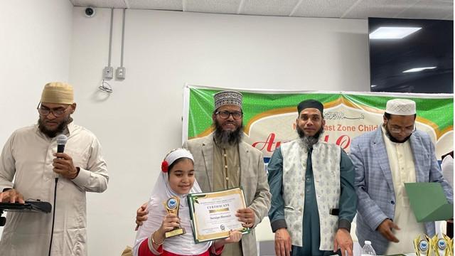 Imam Delwar Hossain handing over certificates to the children