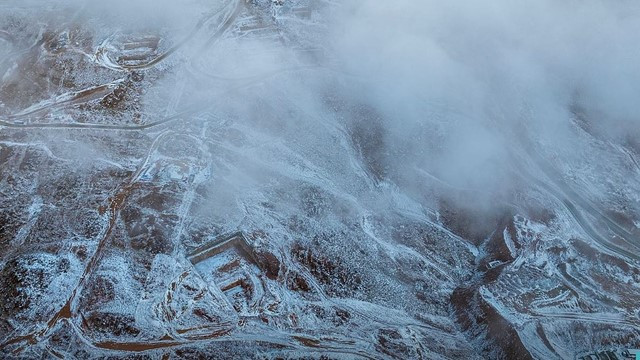 Snowfall on Saudi Desert Horizon, Mountain Peaks Covered in White Blanket